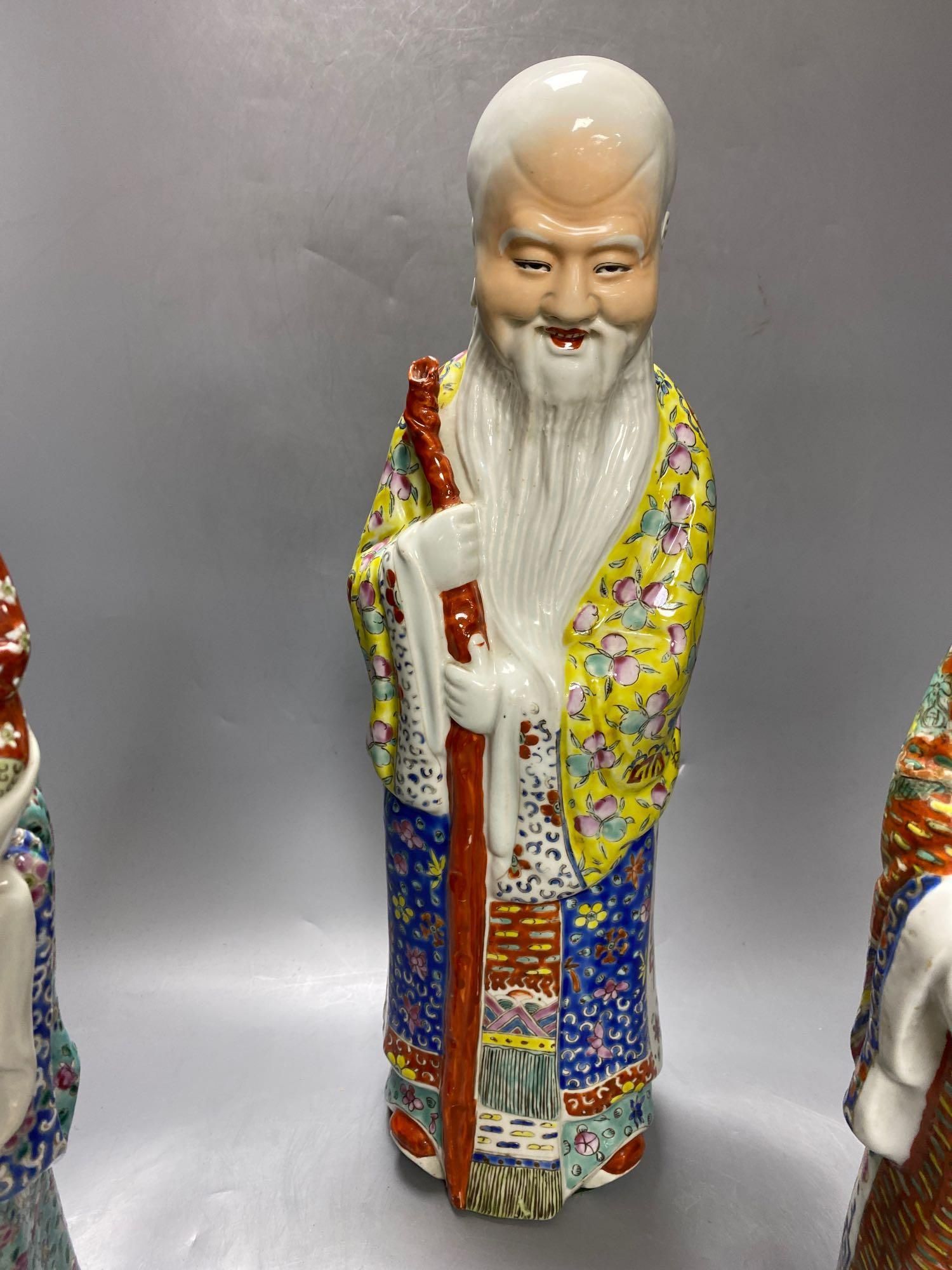 A group of three Chinese porcelain immortals, 47cm